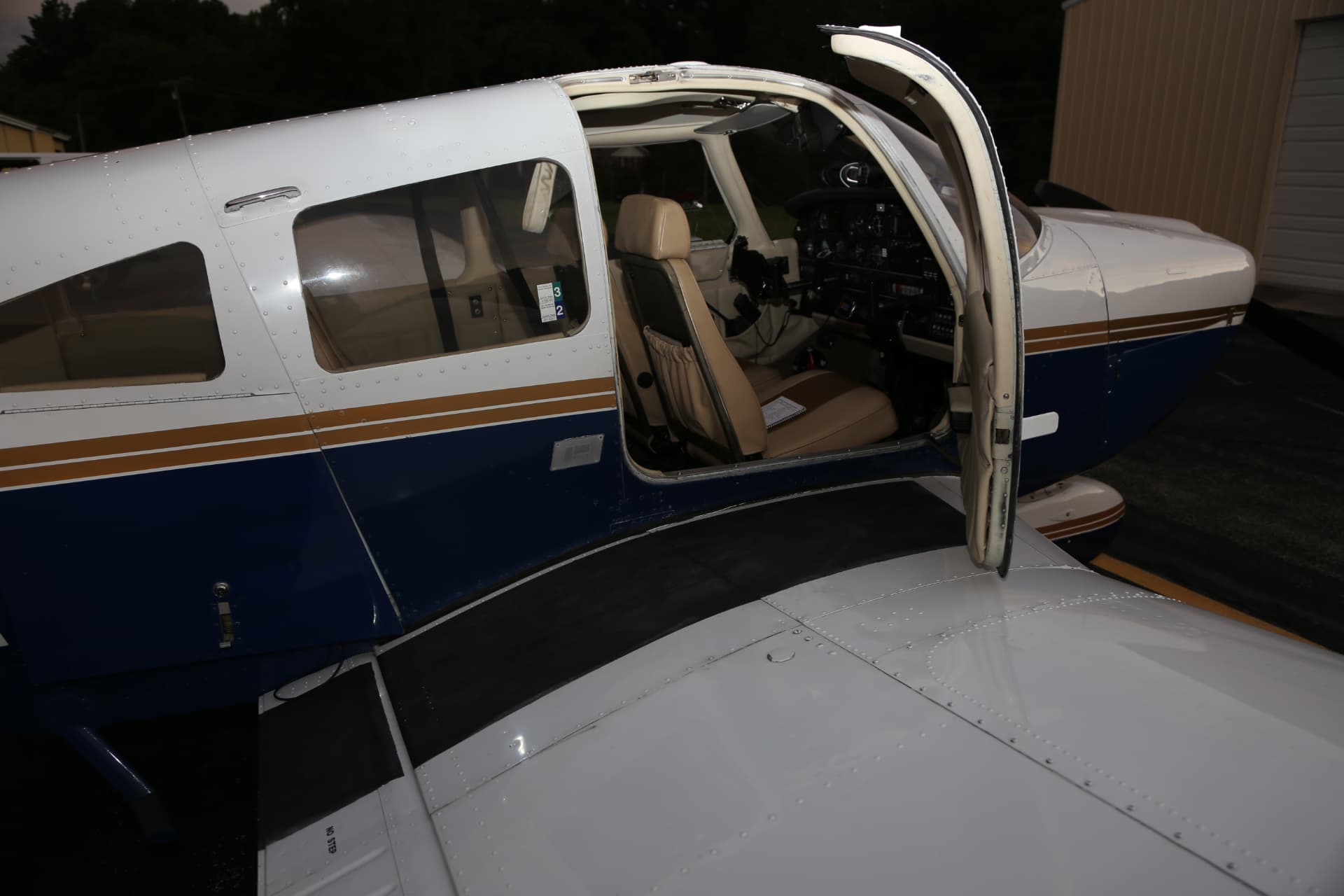 Cabin door open on Piper Archer N2223R showing the instrument panel